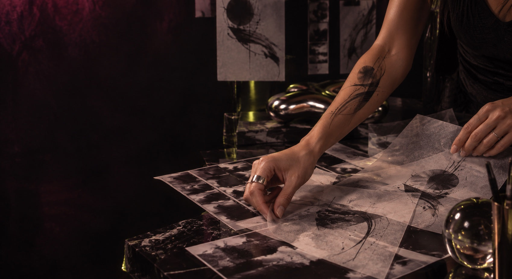 Hands, tracing paper and temporary tattoo studies in the SuperInkLab studio